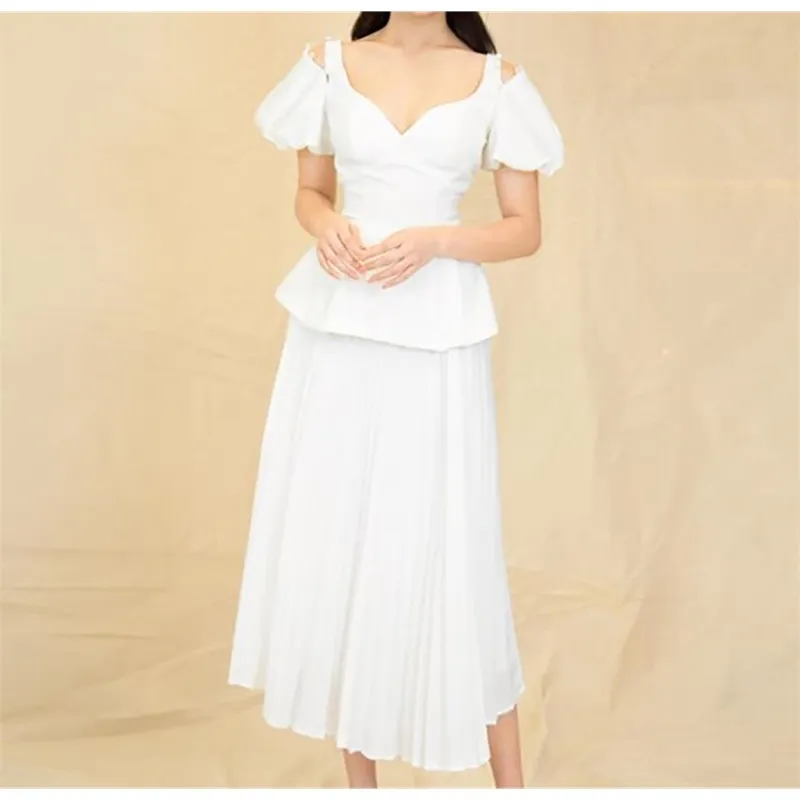Женская одежда набор сексуальный хлопок слоеный рукав белый двух штук вязаная вечеринка знаменитости бинты растениевые вершины плиссированные юбки 210527