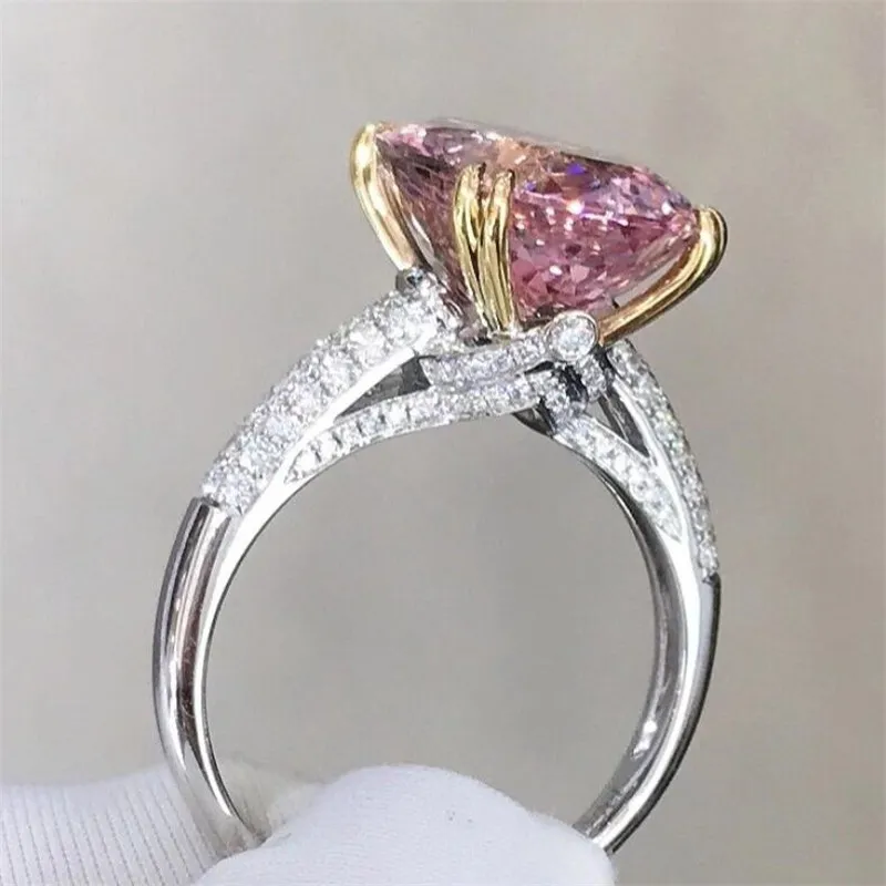 輝く結婚指輪の真新しい高級ジュエリー925スターリングシルバーオーバルカットピンクのTopaz Czダイヤモンド宝石の女性の婚約帯のリングのための恋人ギフト