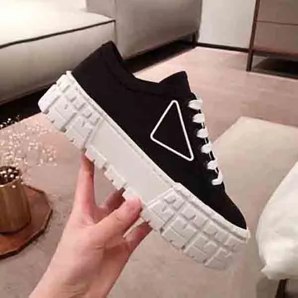 rubber platform women men casual shoes sneaker inspired by motocross tires defines the design of nylon gabardine sneakers this logo triangle decorate50 mm box