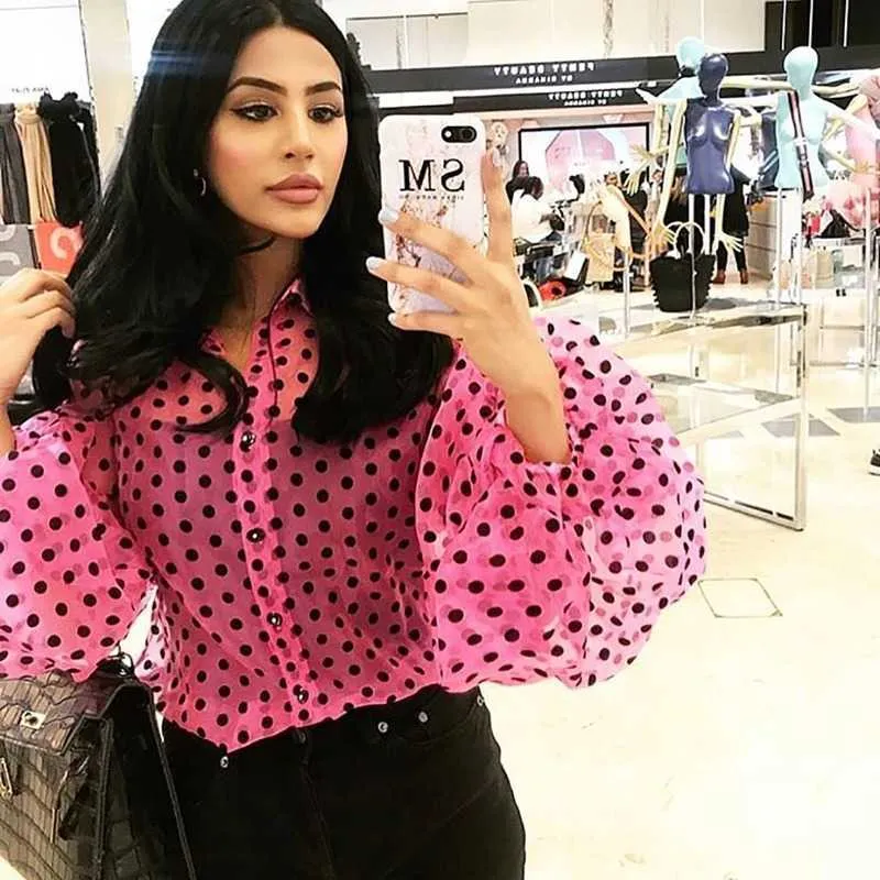 pink and black polka dot blouse