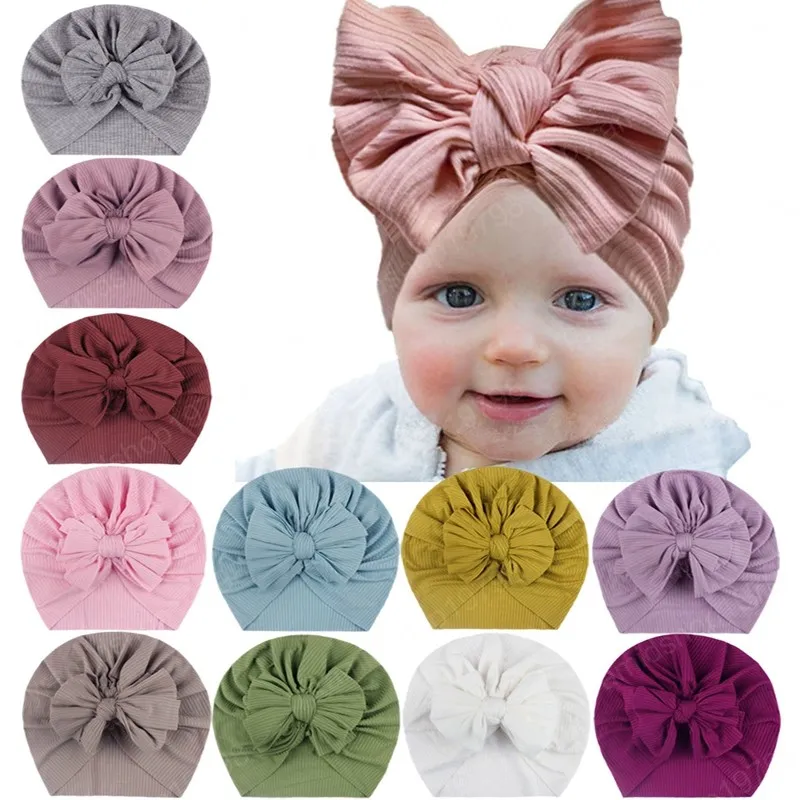 Belle main nœud papillon bébé fille casquettes couleur unie arcs chapeaux en Nylon mode chaud enfants chapeaux accessoires pour bébés accessoires Photo