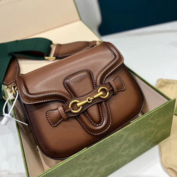 Brown Leather Saddle Bag for Women Luxury Designer Shoulder Bag with Hasp Closure Soft Versatile for Casual and Formal Occasions