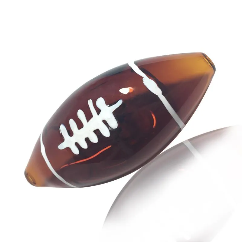 最新のフットボールの形のパイレックスの厚いガラスの喫煙チューブハンドパイプ携帯用手作りドライハーブタバコ石油リグフィルターボンハンドノベルティアートパイプDHL無料