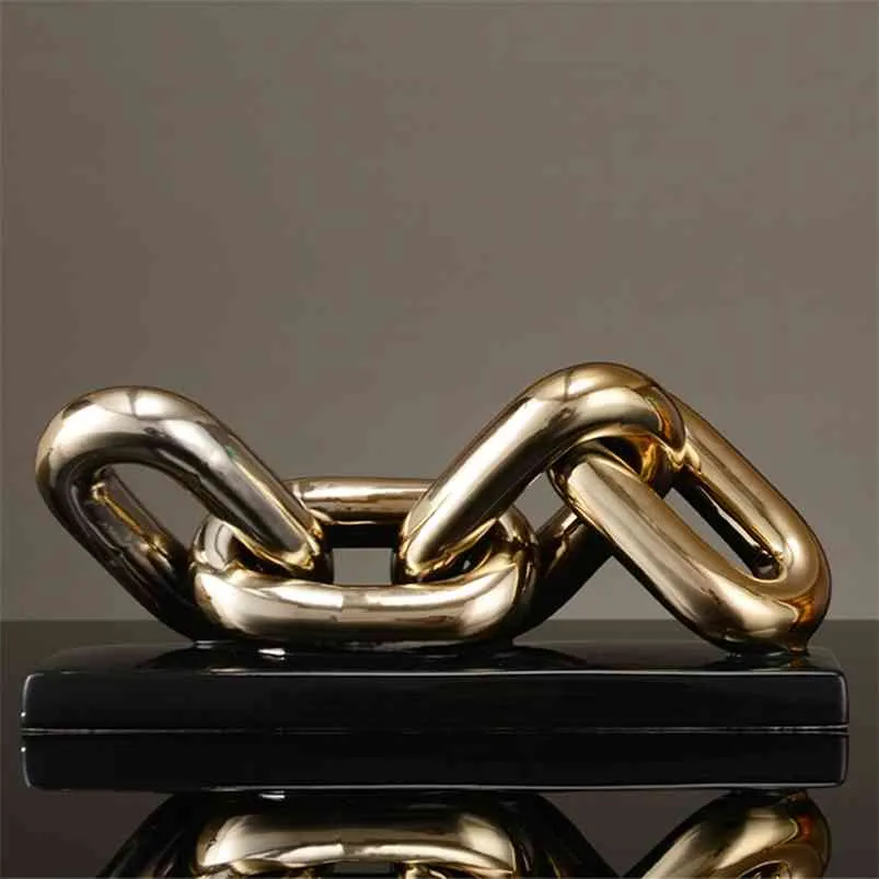 ノルディックゴールデンチェーン彫刻装飾オフィス研究デスクトップセラミック製工芸品リングチェーン磁器家の装飾飾り210811