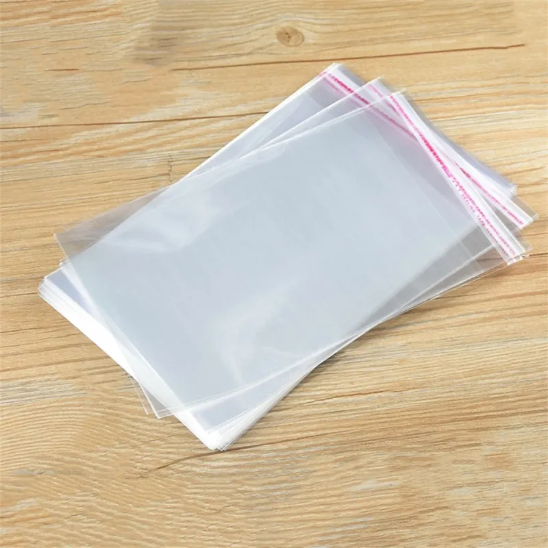 100pcs lot Cellophane Bags Transparent Self Adhesive Sealing Bags Flat OPP Plastic Gift Pouches for Candies Cookies Clothes Jewelry