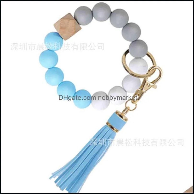 Women`s tassel wood bead silicone bracelet key chain food grade