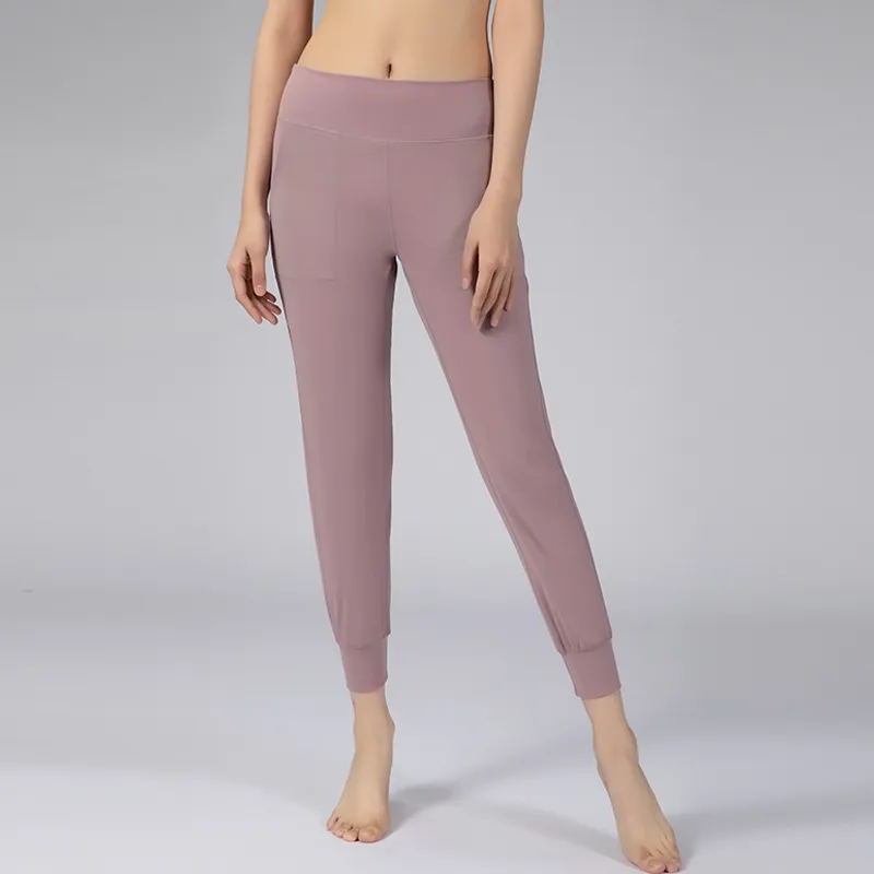 Pantalones de Yoga de tela con sensación desnuda para mujer, mallas deportivas de ajuste holgado con cintura trasera activa y dos bolsillos laterales