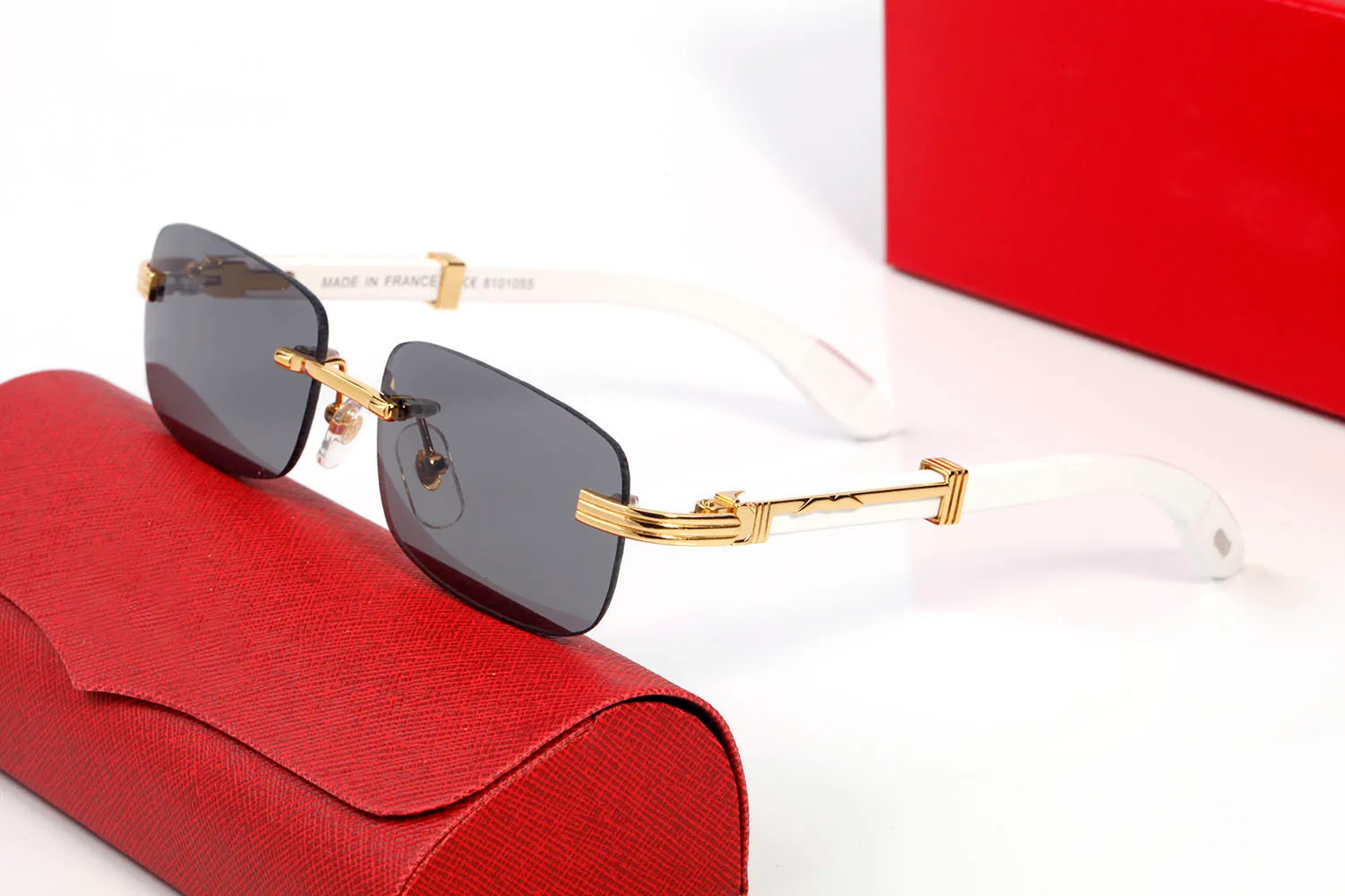 Diseñador de moda Gafas de sol Marcos Tendencia Sin montura Marco de metal dorado Madera Bambú Gafas de cuerno de búfalo Mujeres Hombres Deportes Rojo Eyeglasse272T