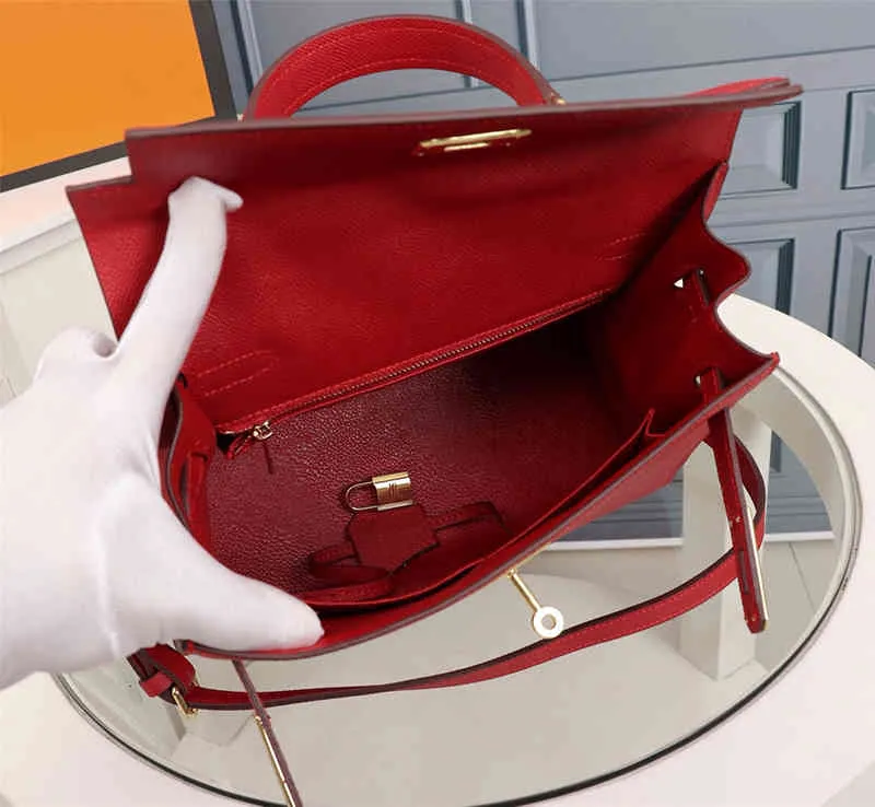 Single shoulder bag 2021 tide female leather oblique cross platinum portable hand palmprint bride redTrendy design niche