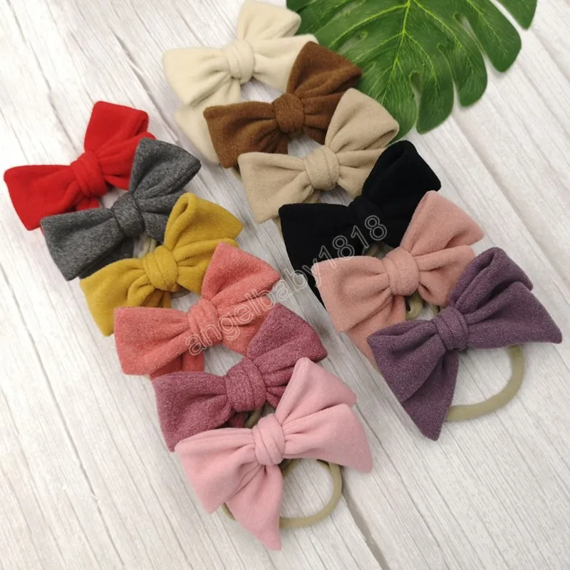 Couleur de couleur continue en daim bowknot bébé filles bandeau tissu à la main des arcs de coiffeur élastique