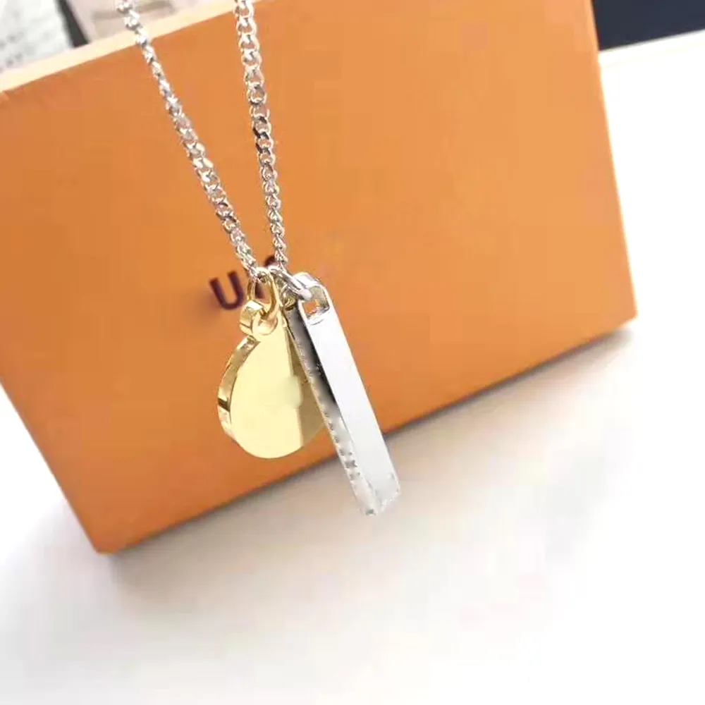 Unisex Luxury Marca mulher dogtag pingente gravado designer de aço inoxidável dupla trava de sorte shell carta anel anel colar número de jóias por atacado presente