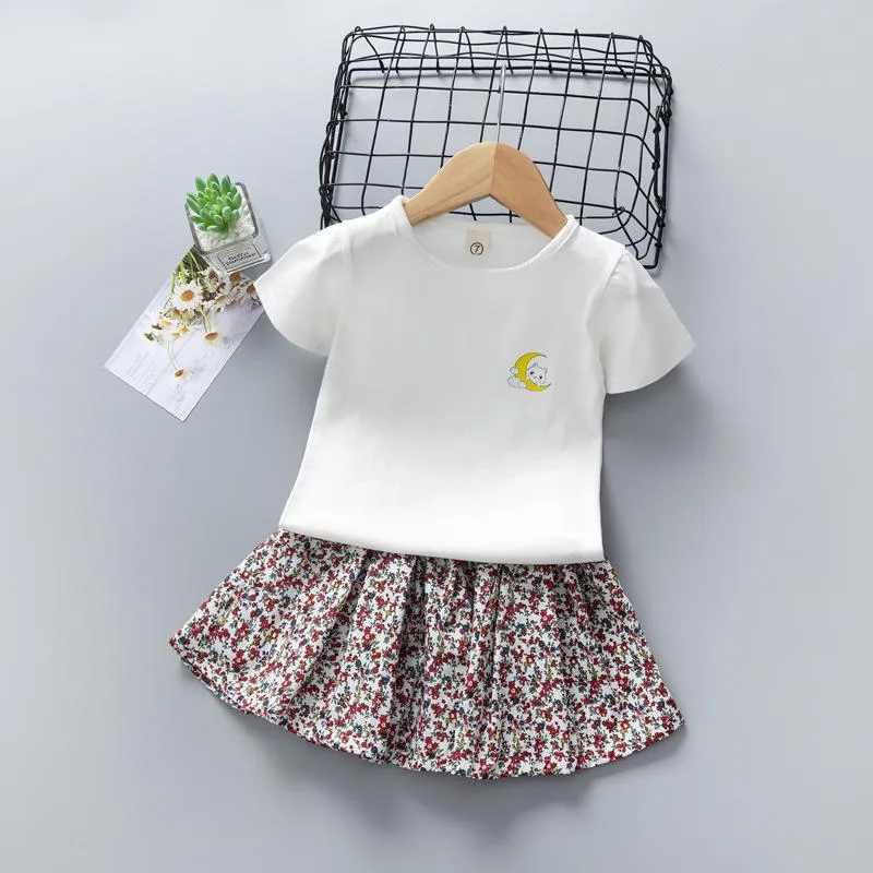 Ensembles de vêtements Baby Girl Summer Set manches courtes 2 3 4 5 7 ans Cartoon T-shirt blanc Jupe florale plissée Costume deux pièces KF1036