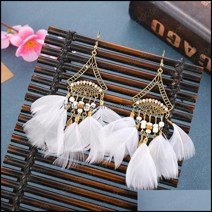 Creative new rice bead earrings super fan-shaped long feather earrings female European and American jewelry wholesale