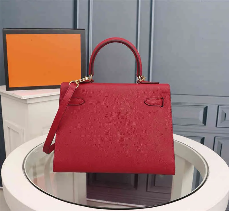 Single shoulder bag 2021 tide female leather oblique cross platinum portable hand palmprint bride redTrendy design niche