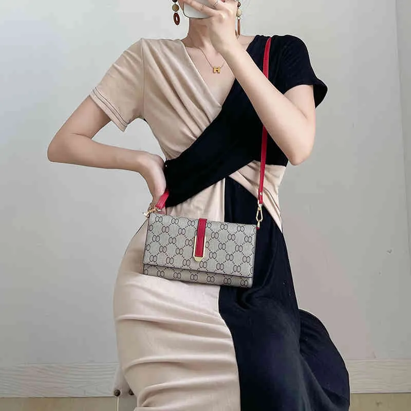 Ny levande sändningskvalitet Enkel plånbok Kvinnors långa handväska diagonal mobiltelefonväska