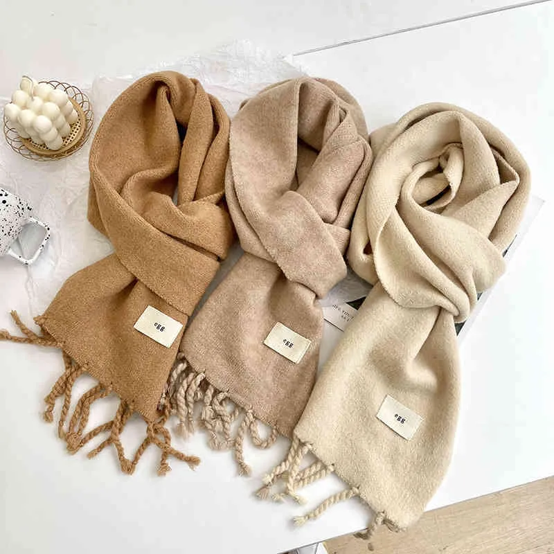 Egg Korean pure color knitted wool scarf for women in autumn and winter versatile thickened warm tassel shawl Bib neck protection