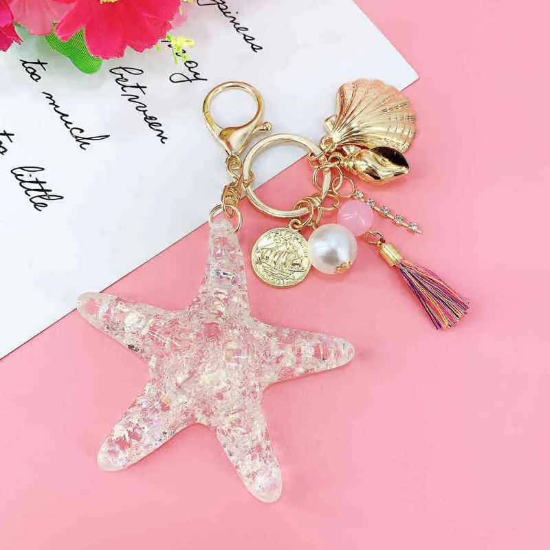 Porte-clés porte-clés fantaisie en cristal étoile à cinq branches pour femmes, pendentif bijoux en alliage, dessin animé, monde océanique, coquillage, étoile de mer