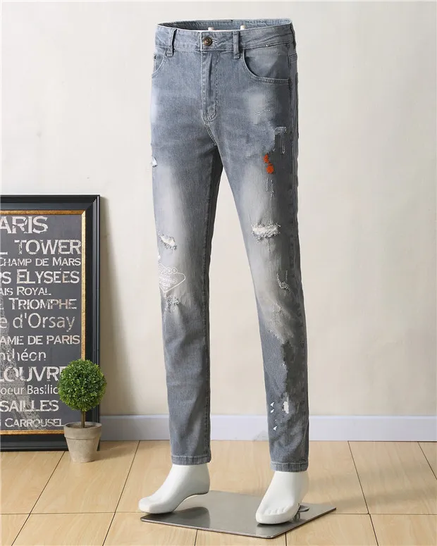 High Quality Mens Designer Luxurys Jeans Light Blue Gray Distressed Business Casual Street Wear Man Jean Rock Slim-leg Fit Ripped Hole Stripe Famous Pants W40