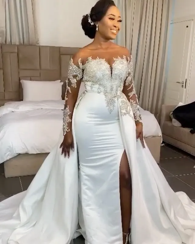 Plus Size Beaded Crystal wedding dress with slit with Detachable Train, Off-Shoulder Illusion Long Sleeves, and Trumpet Style for Special Occasions in Plus Size Beaded Crystal wedding dress with slit with Detachable Train, Off-Shoulder Illusion Long Sleeves, and Trumpet Style for Special Occasions in