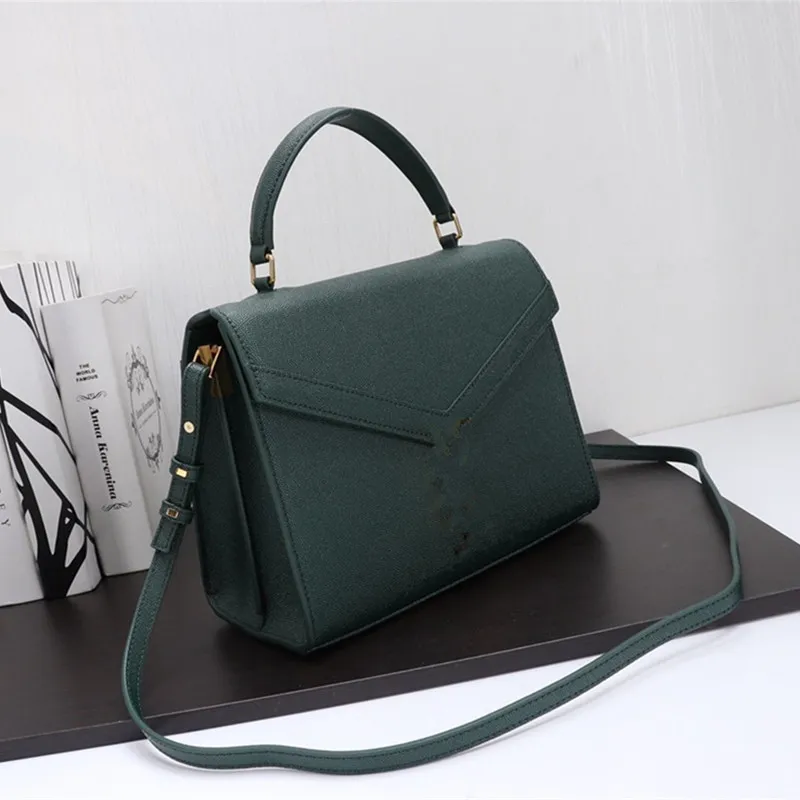 Cassandra medium top handle bag 2025 in grain de poudre embossed leather