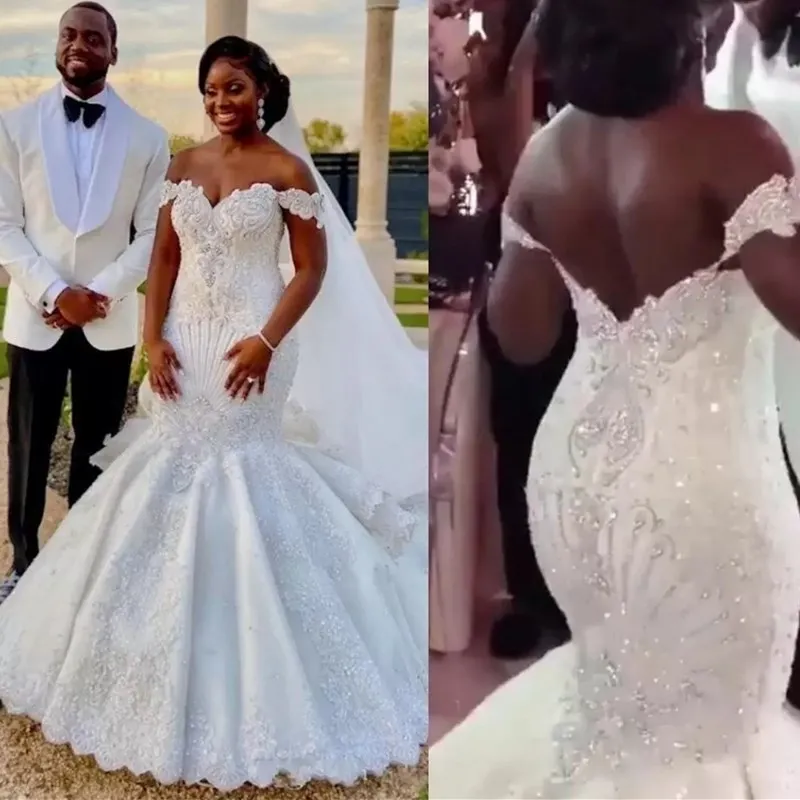 Abiti da sposa a sirena di cristallo di lusso 2022 Africano al largo della spalla Abiti da sposa sexy con perline importanti Pizzo scintillante Vestidos De Novia Abiti senza schienale