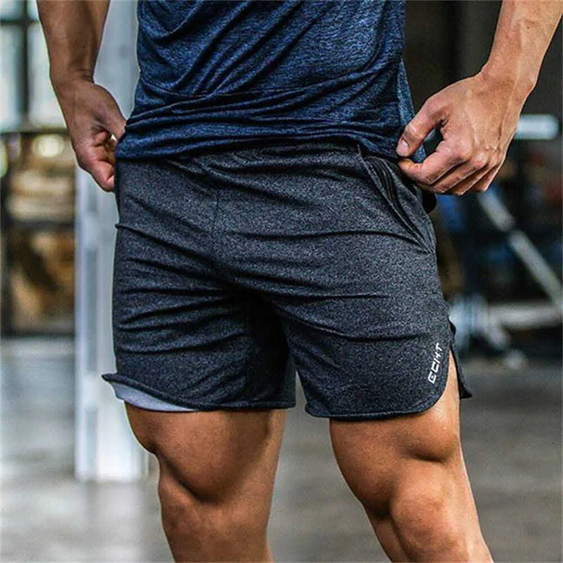Été nouveaux hommes fitness shorts mode gymnases décontractés musculation entraînement mâle mollet longueur pantalon court marque pantalons de survêtement vêtements de sport P0806