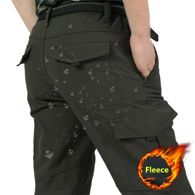 Men Winter Thick Warm Cargo Pants Casual Fleece Pockets Long Trousers Fashion Loose Baggy Jogeer Worker Male Pants 4XL 211112