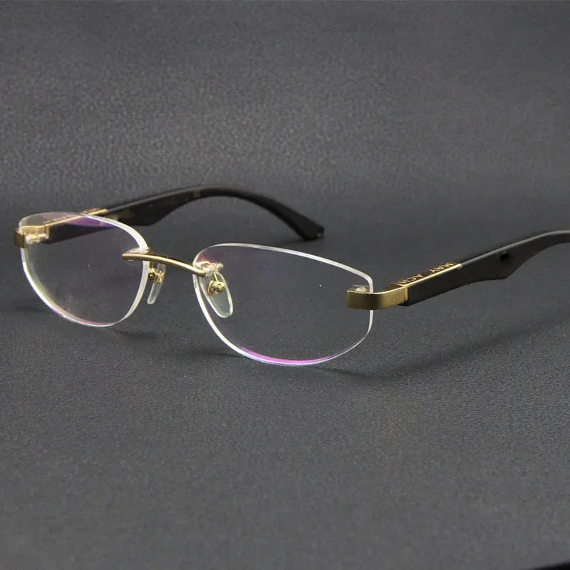 Verkopende eyewear accessoires originele zwarte buffalo hoorn zonnebril de kunstenaar zilveren 18 k goud metalen randloze glazen mannetje en vrouwelijke frame maat: 56-18-135mm