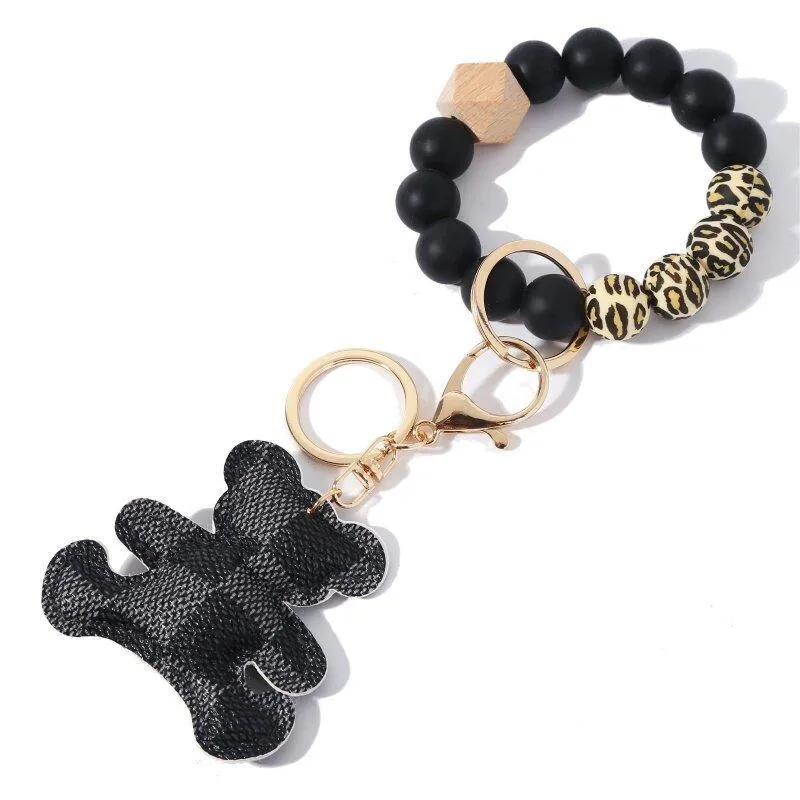 8 Styles Silicone Bead Bracelet Keychain Party Wooded Beads Keyring Old Flower Plaid Bear Decoration Key Ring PU Leather Ornament Bag Pendant DH8975