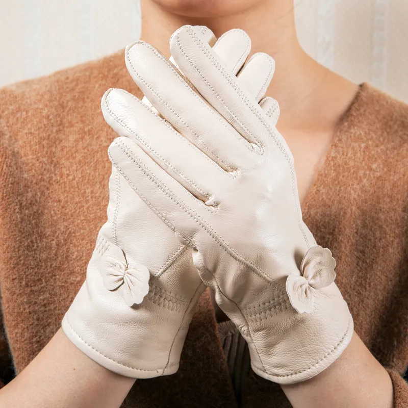 real fur Leather gloves winter women`s white black sheepskin warm thickening plus velvetBow Korean mitten for women