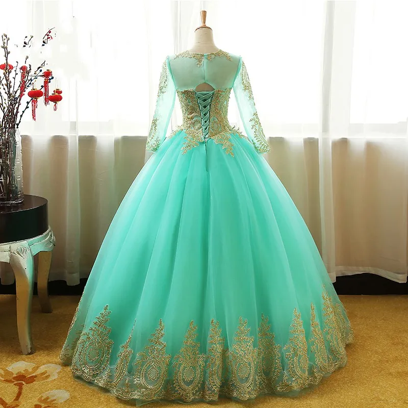 Abito da ballo alla moda alla menta Abiti da dolce 16 con maniche lunghe Illusion Applique in pizzo dorato Tulle Corsetto Collo trasparente Abito quinceanera economico