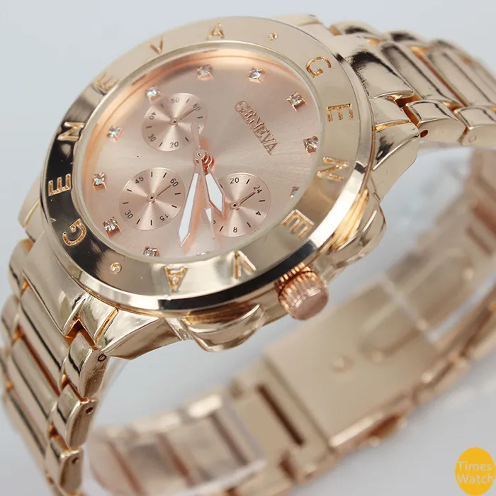 最高品質の2015年新しいジュネーブ腕時計女性合金バンドクォーツ腕時計男性ゴールドウォッチブランドアナログ時計
