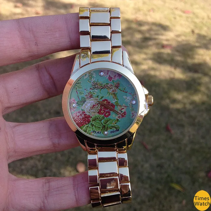 high style on a pretty bracelet watch and finished with a vintage floral print center links. Feel beautiful e