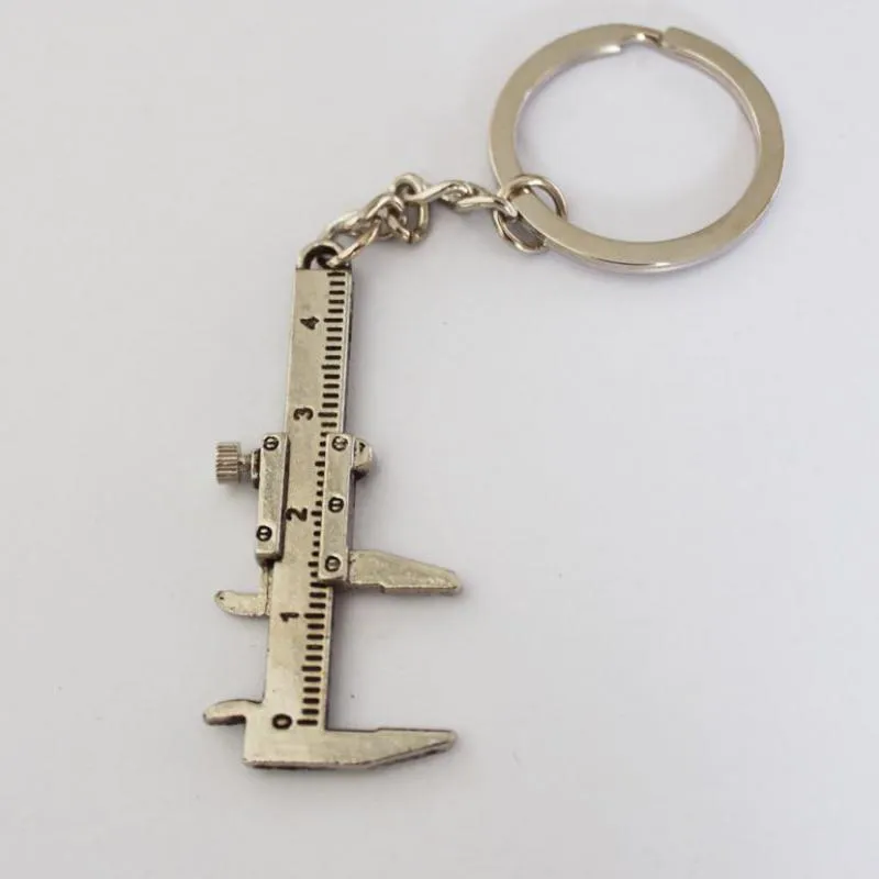 أدوات 10PCS حقيبة كيشاين مفتاح الدائري سلسلة للحصول على هدايا آخر الورنية الفرجار سلسلة المفاتيح زوجين سبائك الزنك سلسلة المفاتيح التيتانيوم مطلي