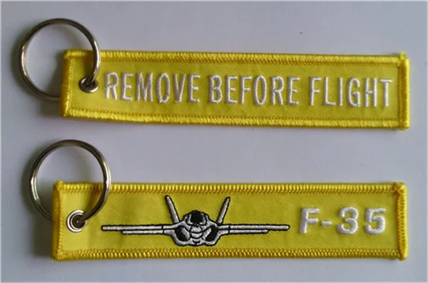 F-35 Enlevez avant les étiquettes de clé d'aviation de chaîne principale de tissu de vol 12.5 x 2.5cm 100pcs
