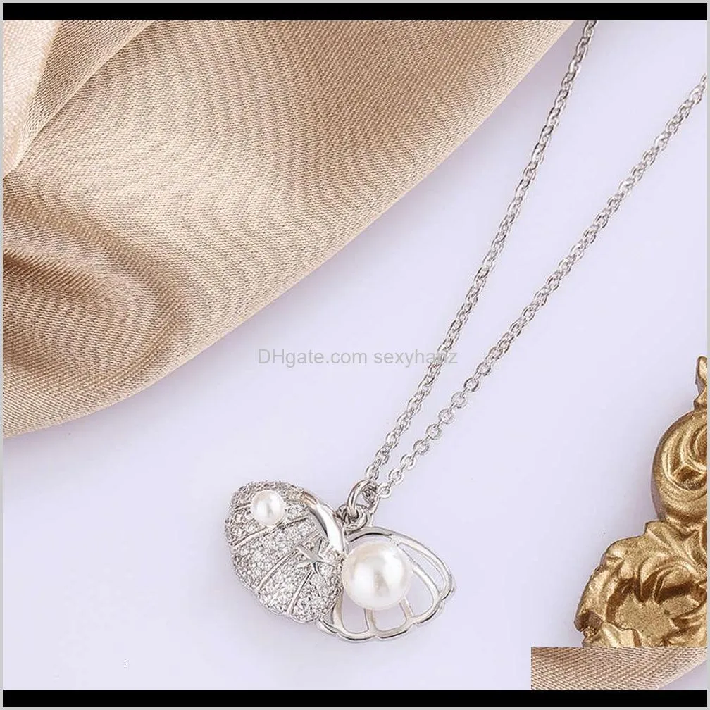 pendants singapore chomel shell pearl necklace women`s  and hollow out high-grade feeling light luxury versatile clavicle chain