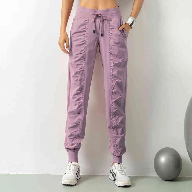 Pantaloni da jogging leggeri da donna di vendita calda con tasche con coulisse allenamento yoga pantaloni da corsa elastico in vita antirughe anteriore 2XL H1221