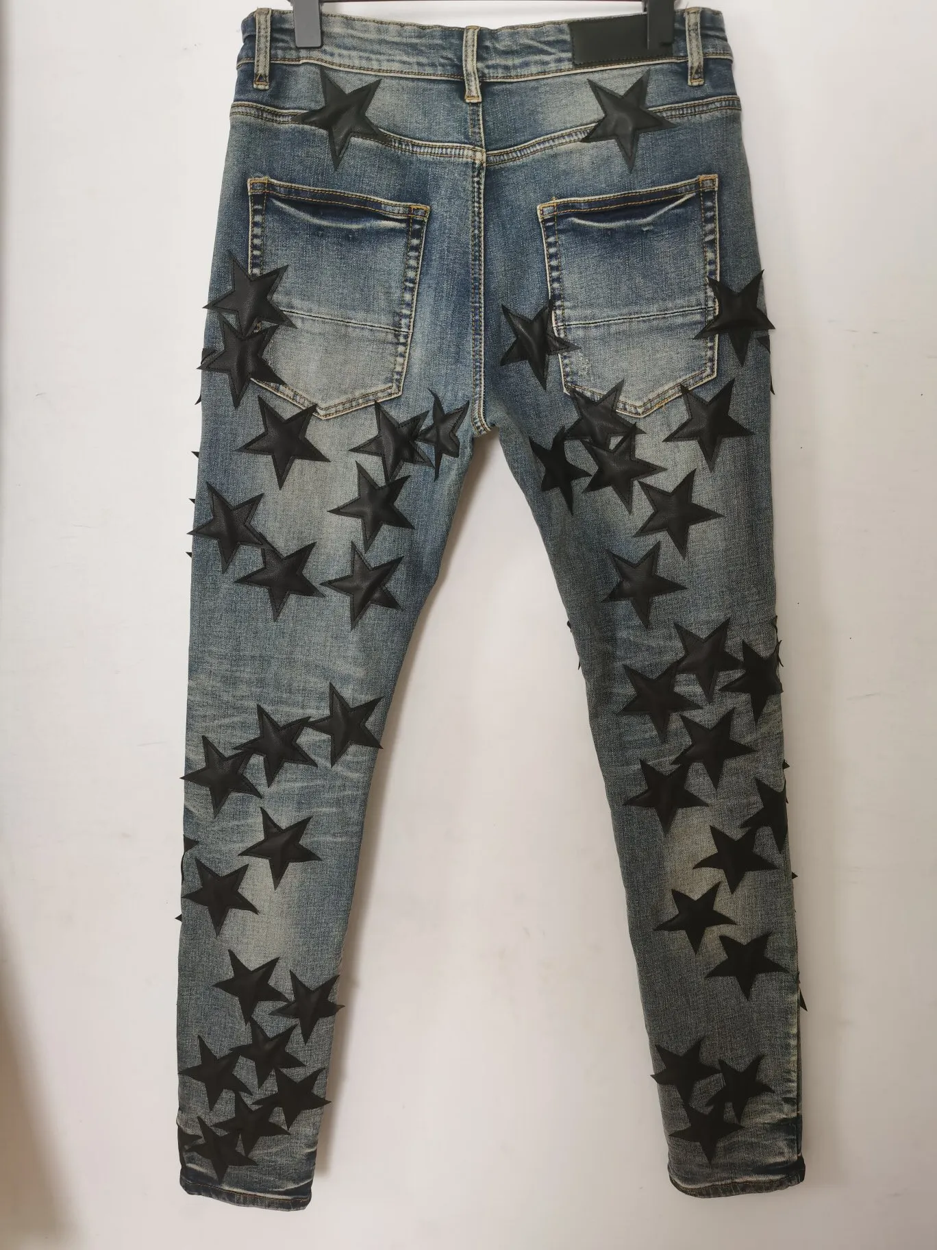 Męskie dżinsy spodnie długie chuda skóra pięcioramienna gwiazda zniszcz kołdrę Raped Hole Projektant mody Jean Men Designers Ubrania 327T