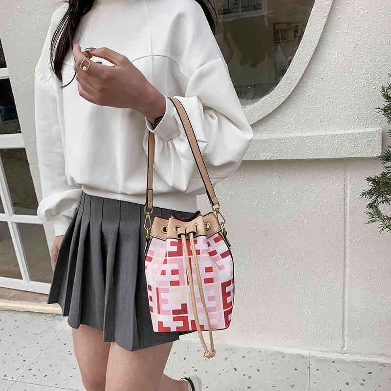 Discount new printed canvas rainbow bucket bag female flower drawstring sling diagonal cross wide shoulder strap handbag Handbags