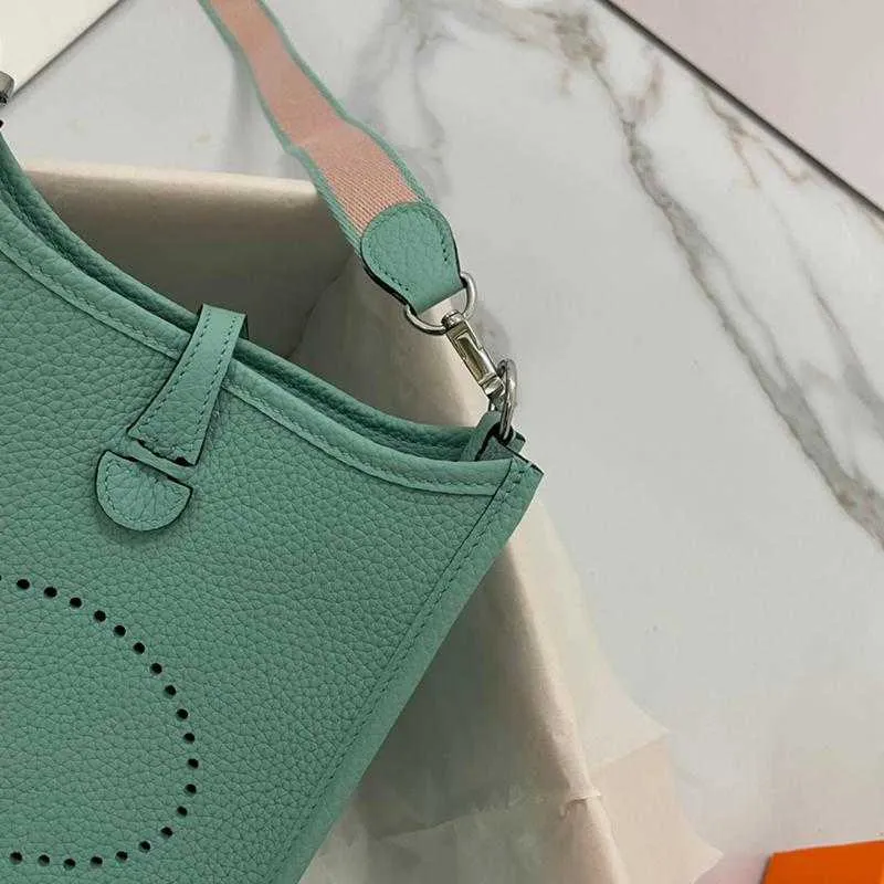 Summer European and American original first layer bag fashion personality design shoulder messenger hollow bucket female tide 2021