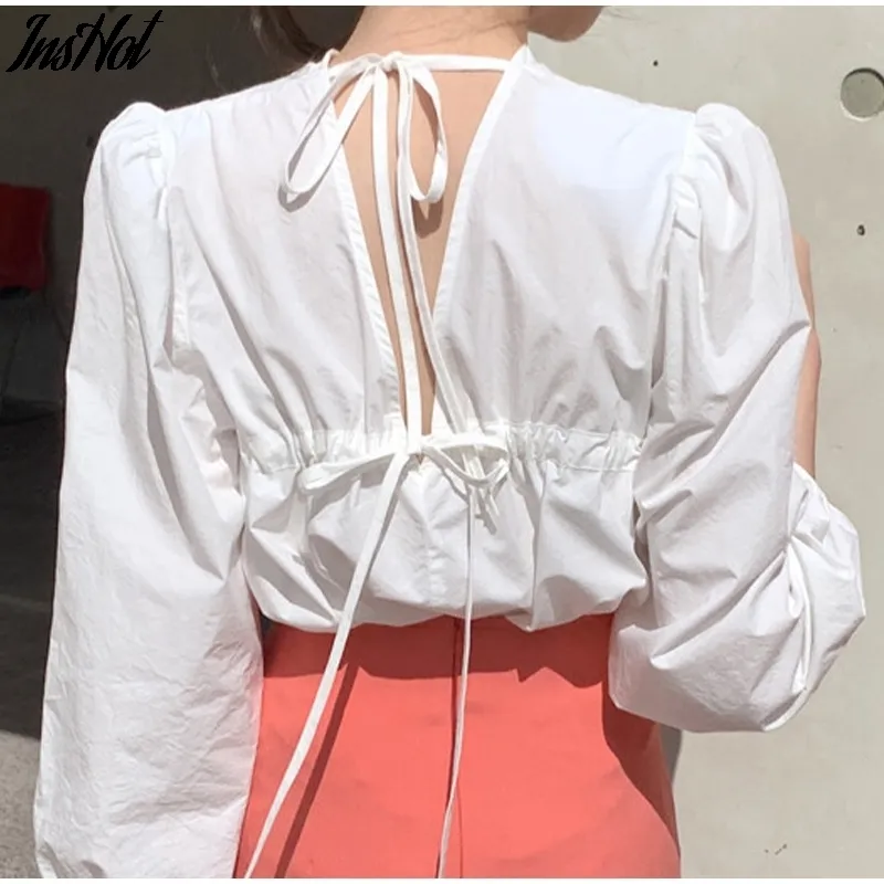 Koreańskie Kobiety Ubrania Lato Wiosna Lace Up Powrót Sexy Backless Round Neck Puff Długi Rękaw White Women Bluzki i Topy Koszulki 210514