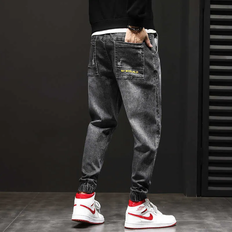 Джинсы мужские растягивают бегущие брюки свободные FIND Скажите привет джинсовой версией спортивных штанов упругих талии елочных брюк х0621