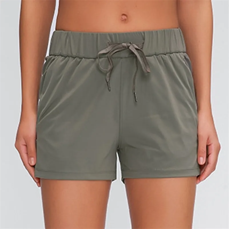 Shorts pour femmes avec poches Shorts de sport pour la course à pied Short en tissu extensible dans les 4 sens 210625