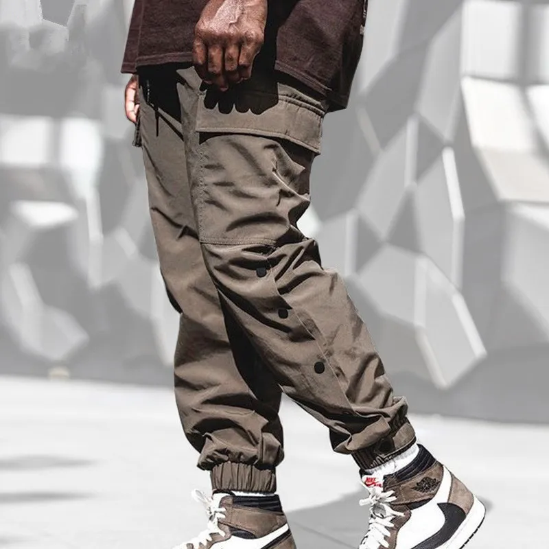Primavera/outono calças casuais masculinas em linha reta multi-bolso cordão sweatpants pernas trespassado design moda calças de carga