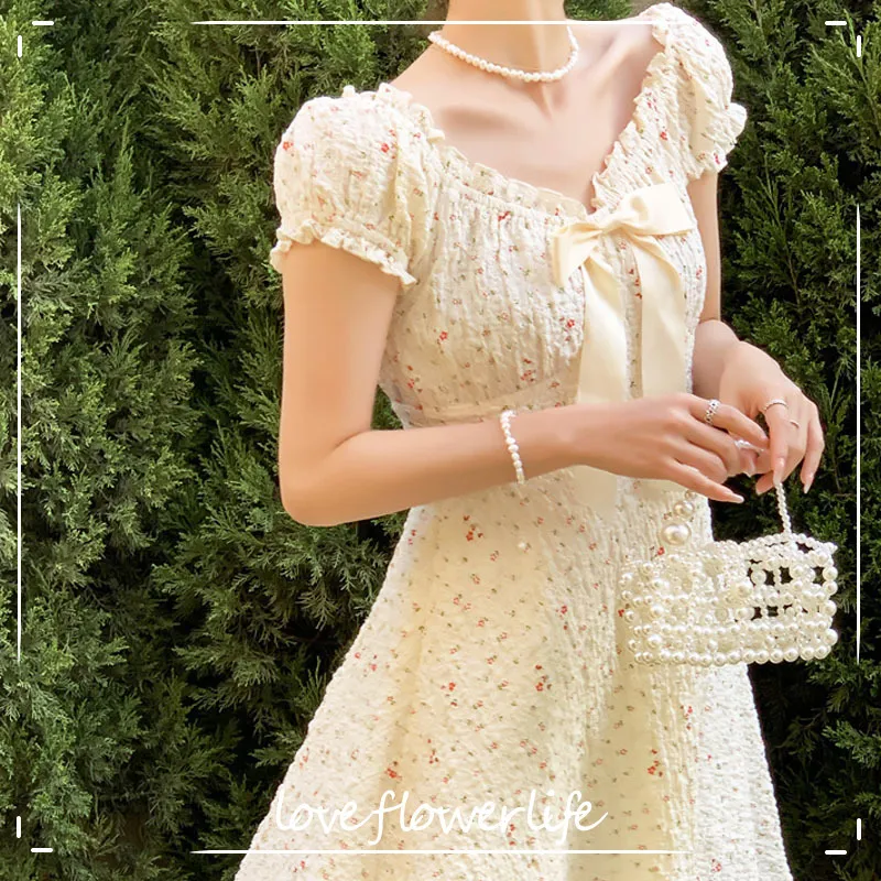 V-образным вырезом Vingate MIDI платье женщины повседневная короткая рукава элегантные цветочные десны дизайн лук платье корея офис леди лето 210521