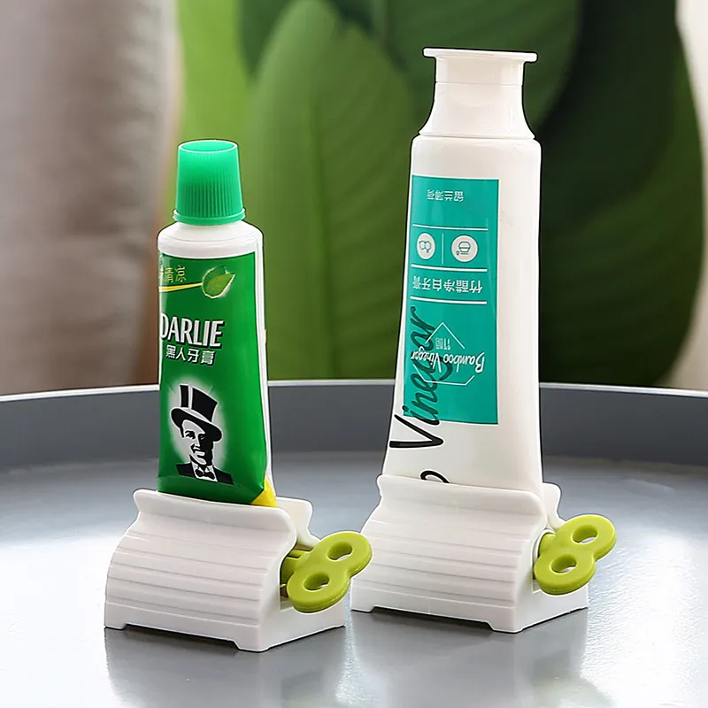 Manuell tandkräm Squeezer Rolling Tube Tooth Pastes Sitthållare Stativ Rotera Dispenser för badrum Toalett