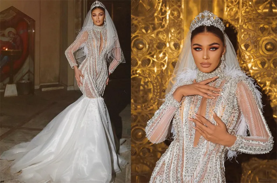 2021 Luxurious Beaded Crystals Mermaid Wedding Dresses See Through High Neck Feather Long Sleeves Bridal Gowns ZJ934