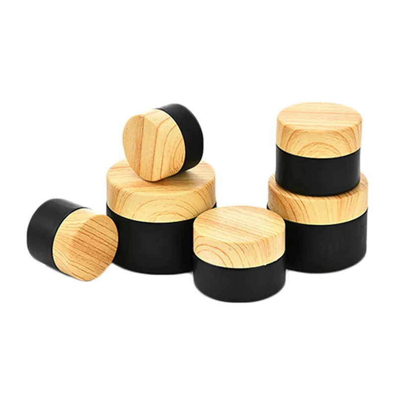 5g 10g 15g 20g 30g 50g Pots cosmétiques en verre dépoli noir Bouteille de crème Récipient d'emballage rechargeable avec couvercle en plastique imité de grain de bois