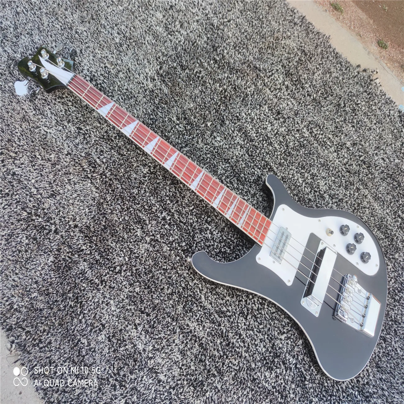 Four string bass black guitar, customizable, chrome plated metal hardware