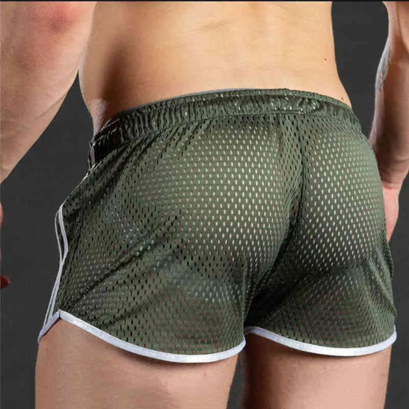 Hommes Shorts d'été couleur unie natation respirant mâle évider Shorts décontracté maille plage troncs décontracté court X0316